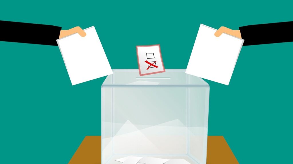 graphic image of people posting their ballot papers into a ballot box