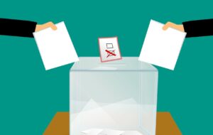 graphic image of people posting their ballot papers into a ballot box