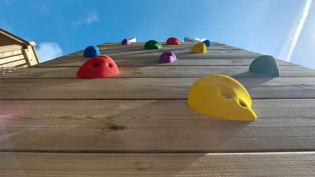 View from the bottom, looking up, of a new climbing wall at Penlee Play Park